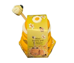 Ceramic honey jar with wooden bee honey collector