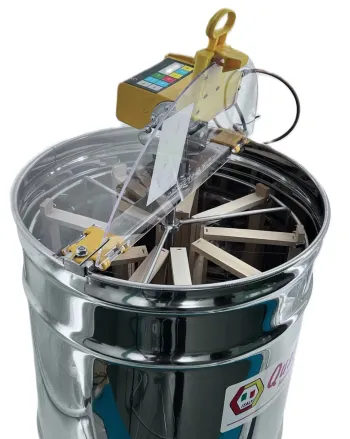 Motorized table-top radial honey extractor with 9 frames