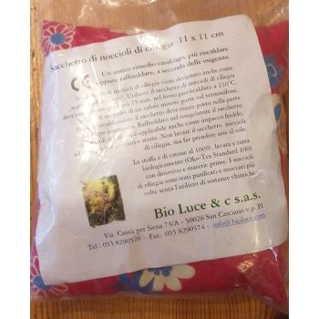 Coussin "croissant" en noyaux de cerises